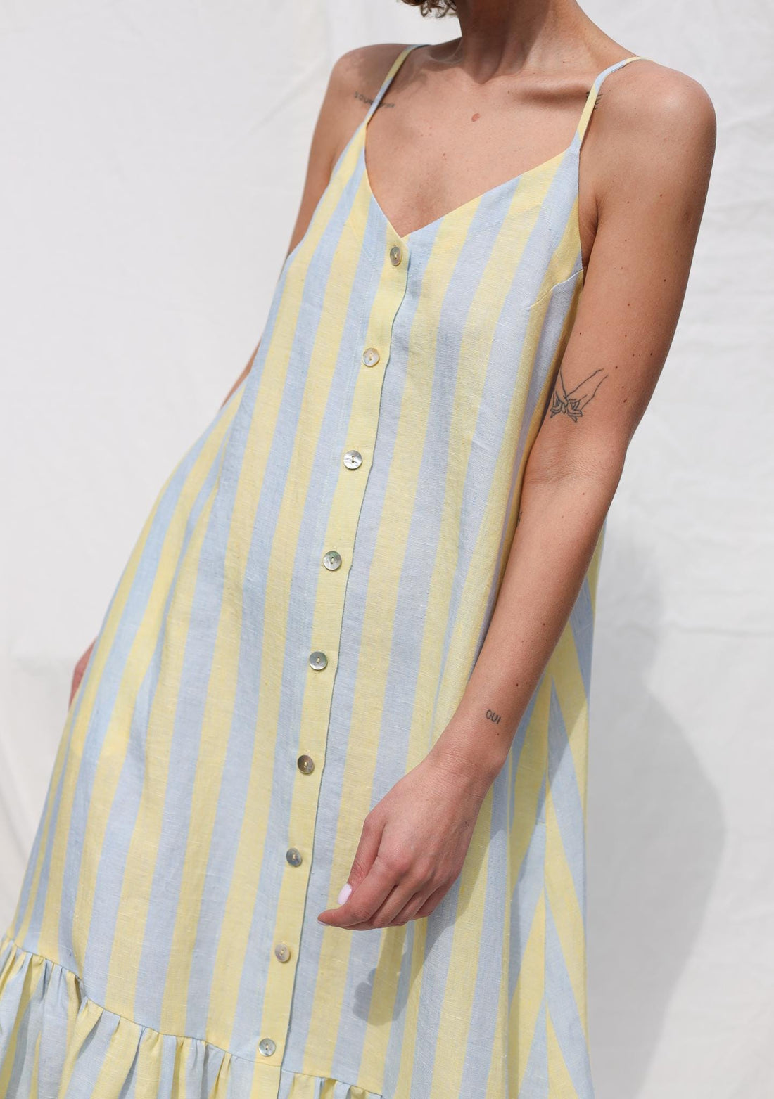 Sleeveless Striped Linen Dress with Ruffled Hem by OFFON Clothing