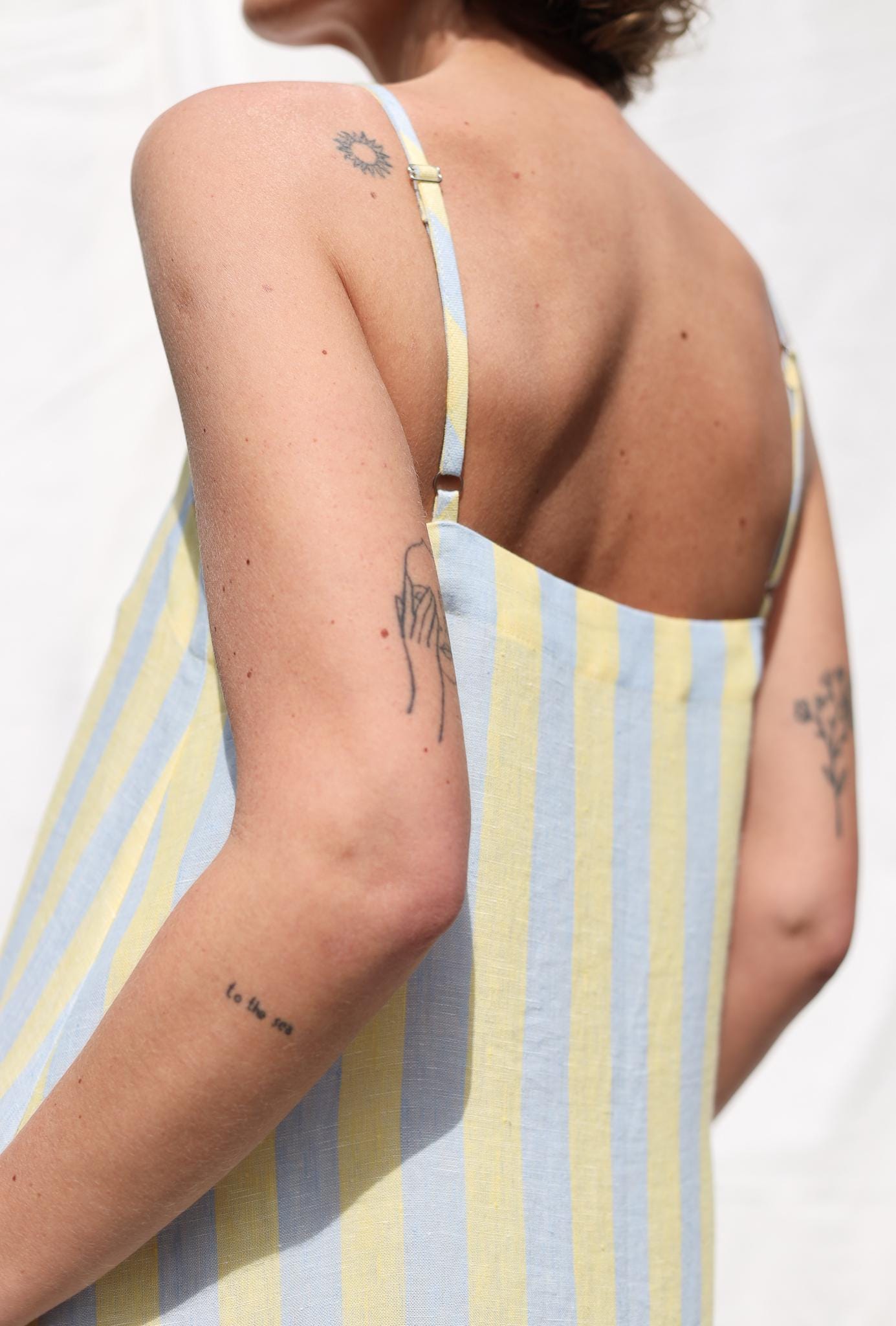 Sleeveless Striped Linen Dress with Ruffled Hem by OFFON Clothing
