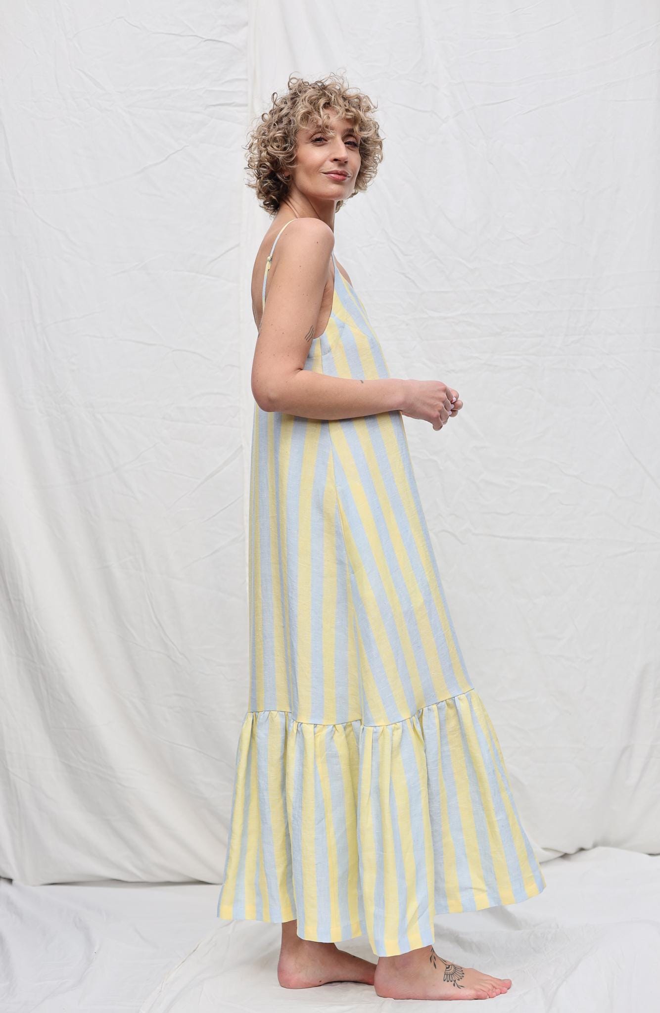 Sleeveless Striped Linen Dress with Ruffled Hem by OFFON Clothing