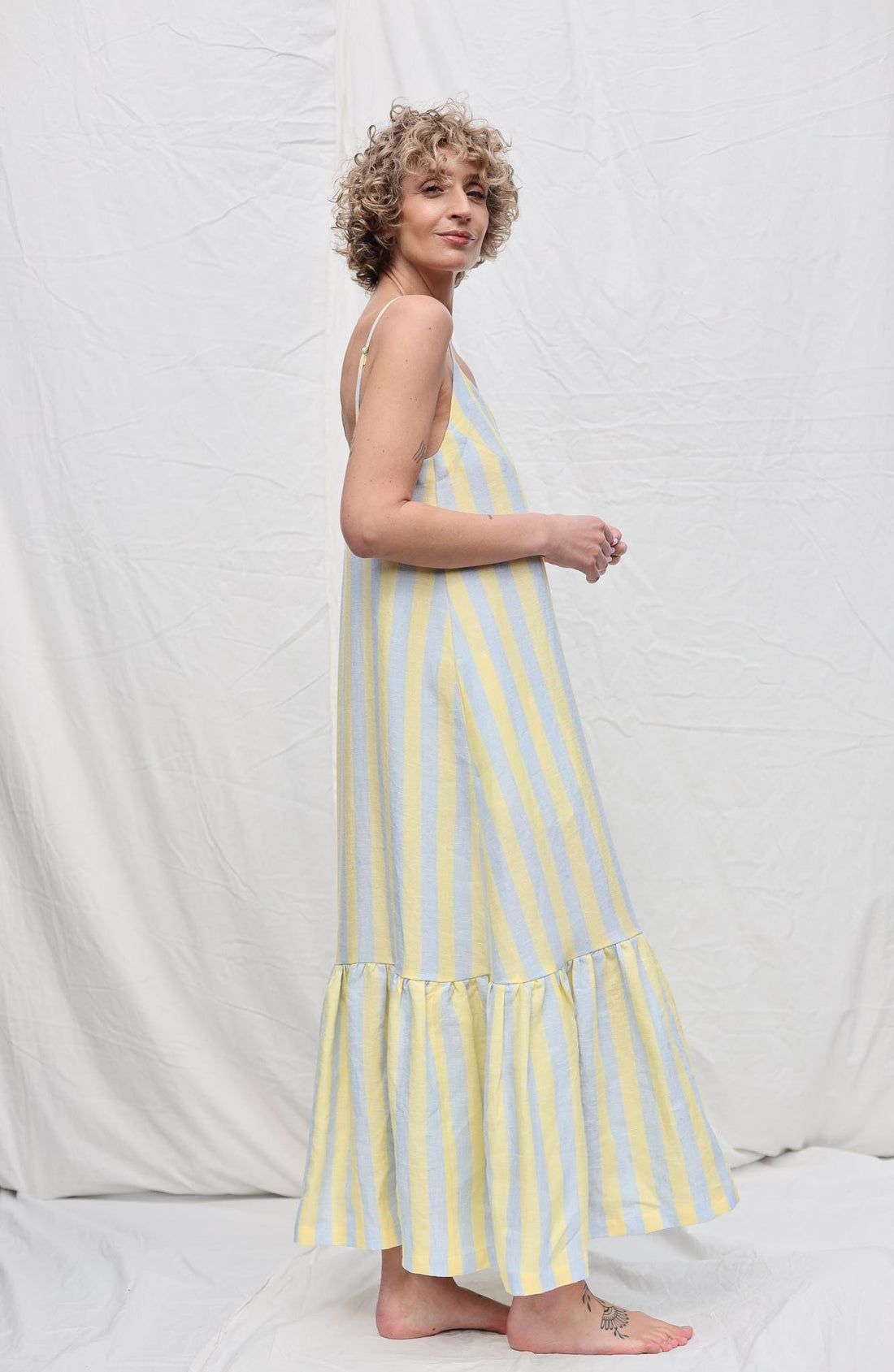 Sleeveless Striped Linen Dress with Ruffled Hem by OFFON Clothing